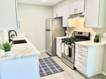 A kitchen with stainless steel appliances and a counter top